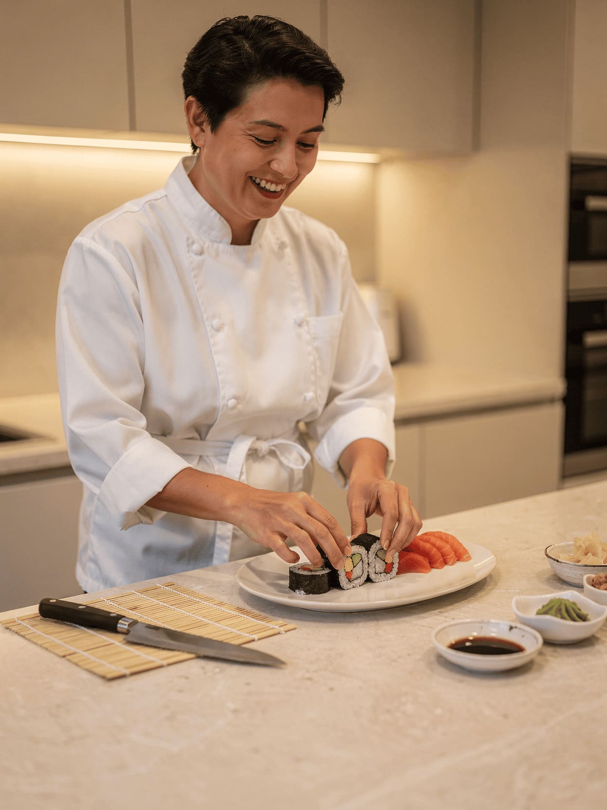 happy person making sushi at home kitchen